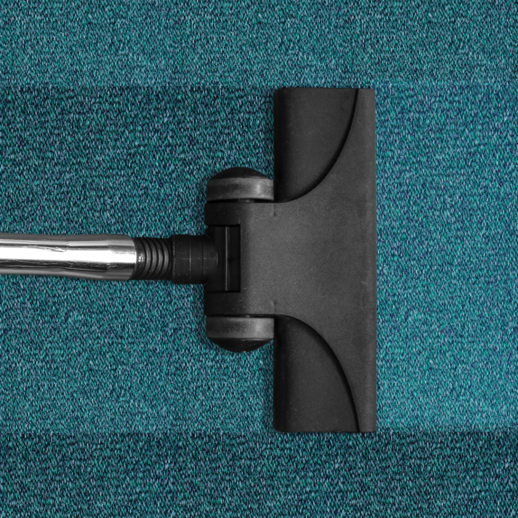 A vacuum performing carpet cleaning services